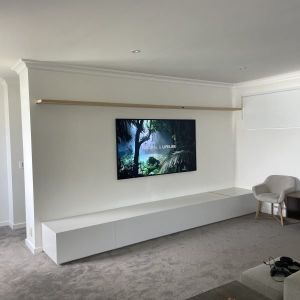 Flat-screen TV mounted on drywall in residential home