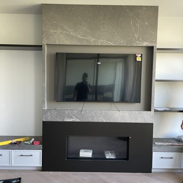 Flat-screen TV mounted on drywall in residential home